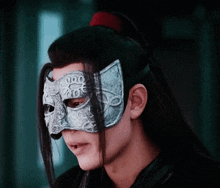 a man wearing a mask with a cat face on it