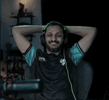 a man wearing headphones and a shirt that says s on it