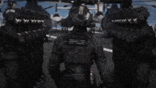 a group of soldiers are standing on a runway in front of a bunch of helicopters .