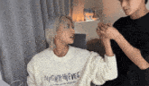 a man wearing a sweater that says nightthieves