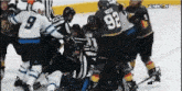 a hockey player with the number 92 on his jersey is fighting another player