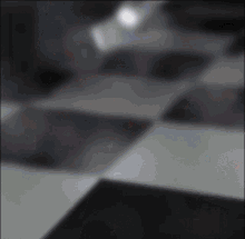 a black and white checkered floor with a picture of a girl