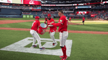 a group of baseball players on a field with one wearing the number 9