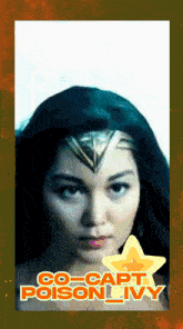 a woman in a wonder woman costume with the words co-capt poison ivy on the bottom