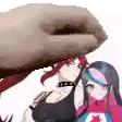 a hand is holding a woman 's head while another woman stands next to her .