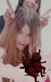 a man and a woman are posing for a picture with devils dancing in front of them