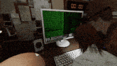 a man and woman are looking at a computer screen which says cam on it