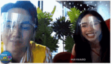 a man and a woman wearing face shields with mayward written on the bottom right