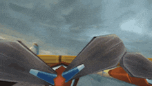 a video game character is flying through the air with a cloudy sky behind him