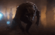 a werewolf is standing in a dark room with his mouth open