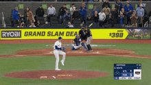 a baseball game is being played in front of a large ryobi ad