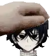 a hand is putting a donut on a person 's head .