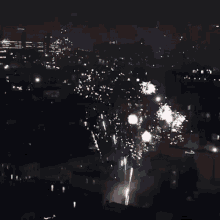 a bunch of fireworks are going off in the sky