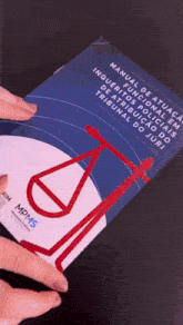 a person is holding a book that says mdms on the cover
