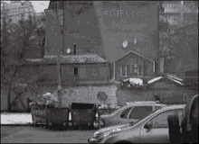 a 4gifs.com image of a parking lot with cars