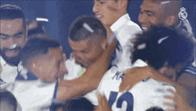 a group of soccer players are huddled together with one wearing the number 10
