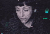 a woman wearing headphones is making a silly face