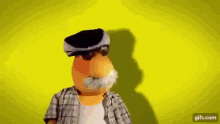 a cartoon character with a mustache and sunglasses is standing in front of a yellow background .