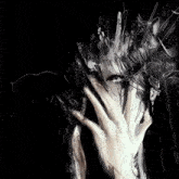 a drawing of a person covering their face with a hand