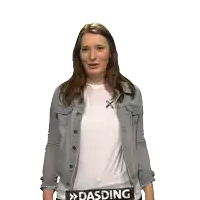a woman wearing a denim jacket and a white shirt with the word dasding on her waist