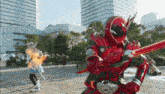 a man in a red superhero costume is holding a sword