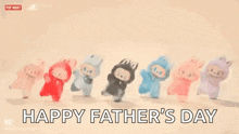 a group of stuffed animals are standing next to each other in a row and saying happy father 's day .