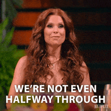 a woman with red hair is saying we 're not even halfway through