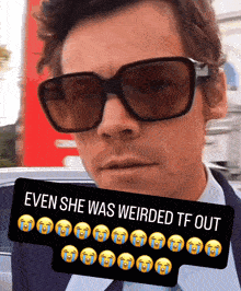 a man wearing sunglasses has a sticker that says even she was weirded tf out