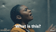 a poster for ironheart shows a woman 's back and the words " what is this "