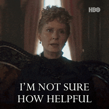 a woman sitting in a chair with the words " i 'm not sure how helpful " on the bottom