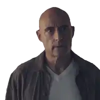 a bald man wearing a brown jacket and white shirt