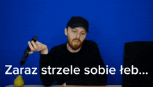 a man holding a gun to his head with the words zaraz strzele sobie feb
