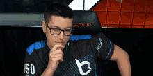 a man wearing glasses and a shirt that says pawn
