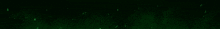a green light beam is shining on a black background