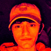 a young man wearing a hat that says nyc