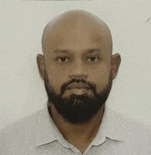 a man with a beard and a bald head