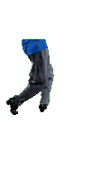 a person in a blue shirt and black pants is standing with their hands on their hips