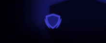 a blue shield is glowing in the dark on a dark background .