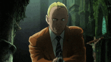 a man in a suit and tie is holding a gun in a dark room
