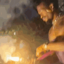 a blurry picture of a man playing a guitar