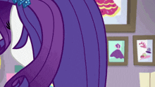 a cartoon pony with purple hair is standing in front of framed pictures