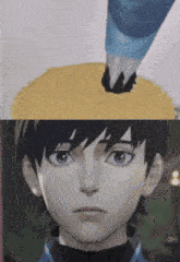 a close up of a boy 's face with a yellow object on his head