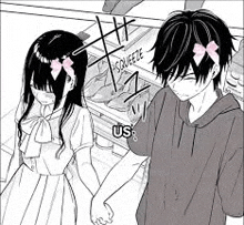 a boy and a girl are holding hands in front of a store .