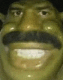 a close up of shrek 's face with a mustache and hat .