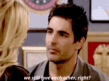 a man and a woman are talking to each other and the man is asking if they still love each other .