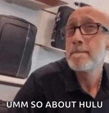 a man with glasses and a beard is saying umm so about hulu