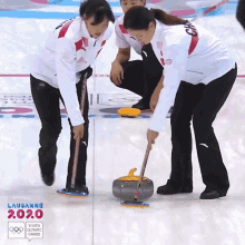 curling youth olympic games sweeping sliding teamwork