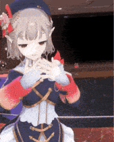a girl with a hat and gloves is making a heart shape with her hands