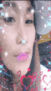 a woman 's face is surrounded by hearts and sparkles