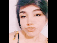 a close up of a woman 's face with her eyes closed